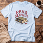 Read Slowly Book T‑Shirt