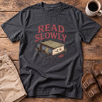 Read Slowly Book T‑Shirt