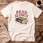 Read Slowly Book T‑Shirt