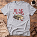 Read Slowly Book T‑Shirt
